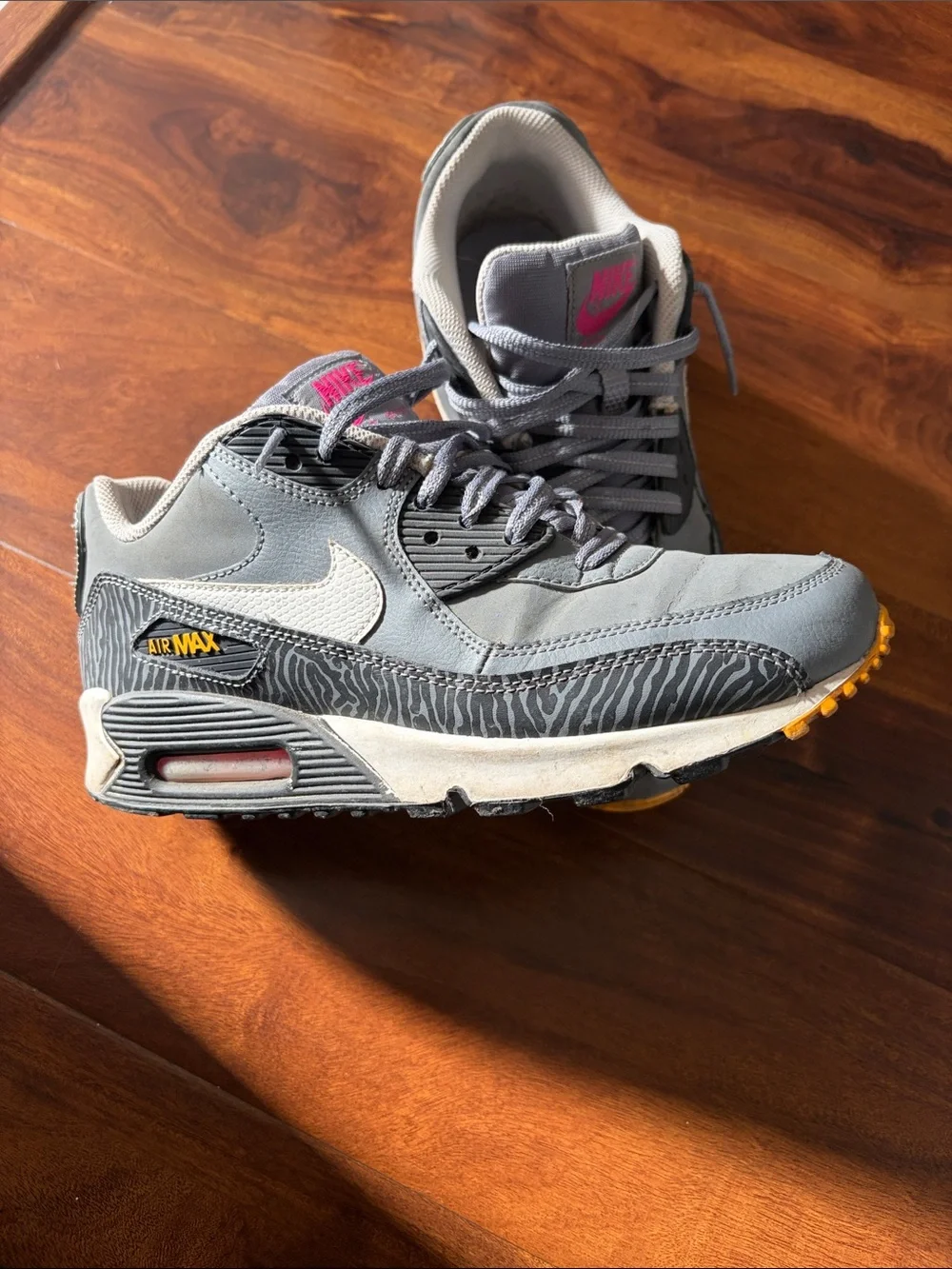 Nike Gray Sneakers with Pink Logo and Yellow Outsole